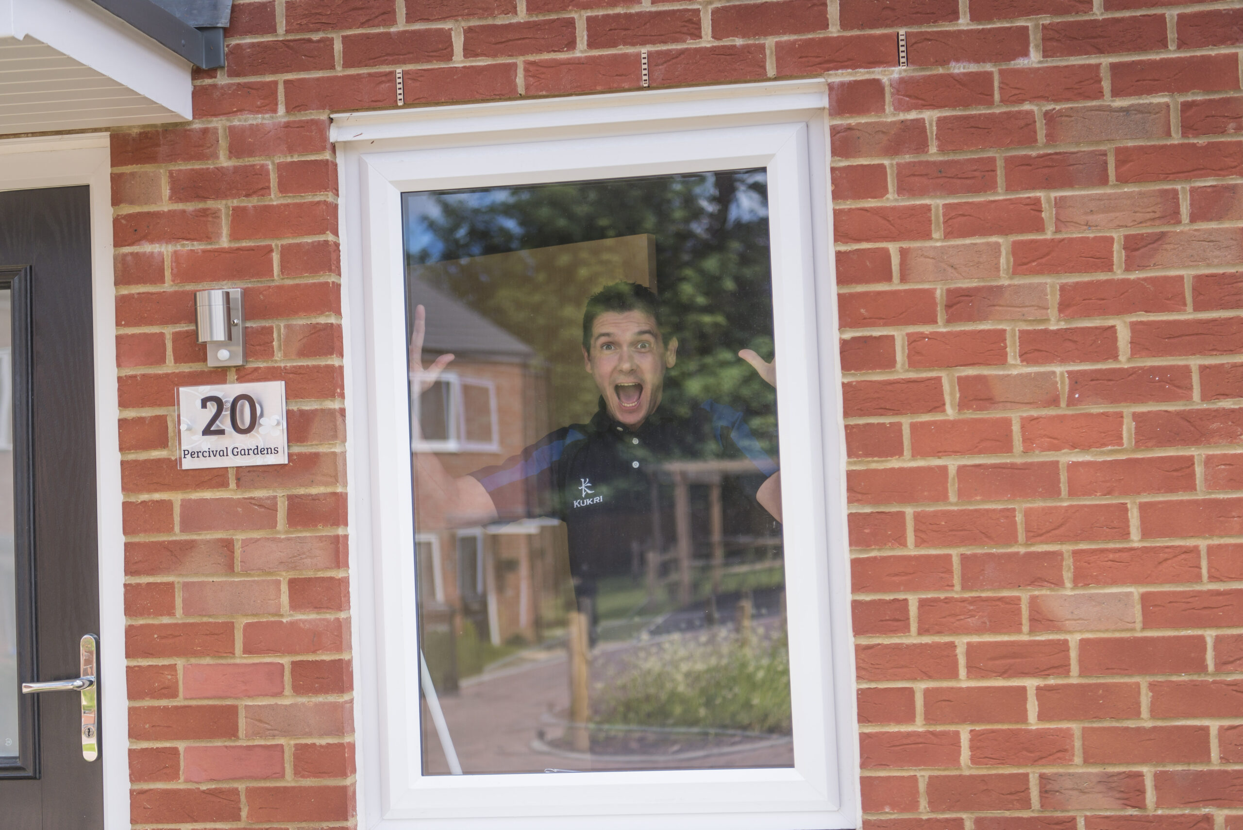Looking out through the front window of the couple's home