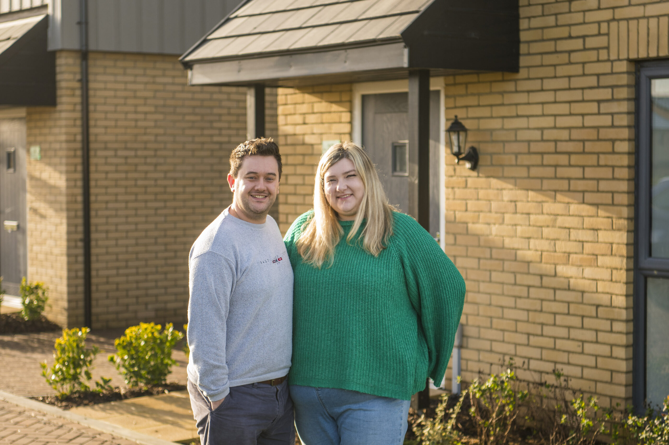 Maddison and Daniel outside their new home