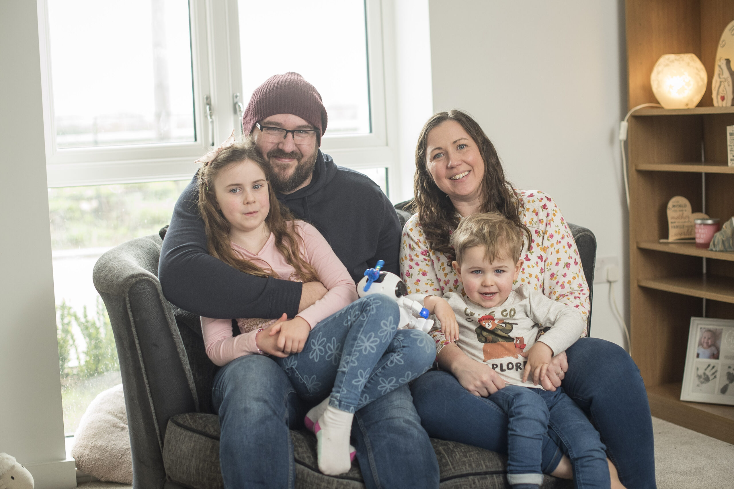 The family together on their sofa