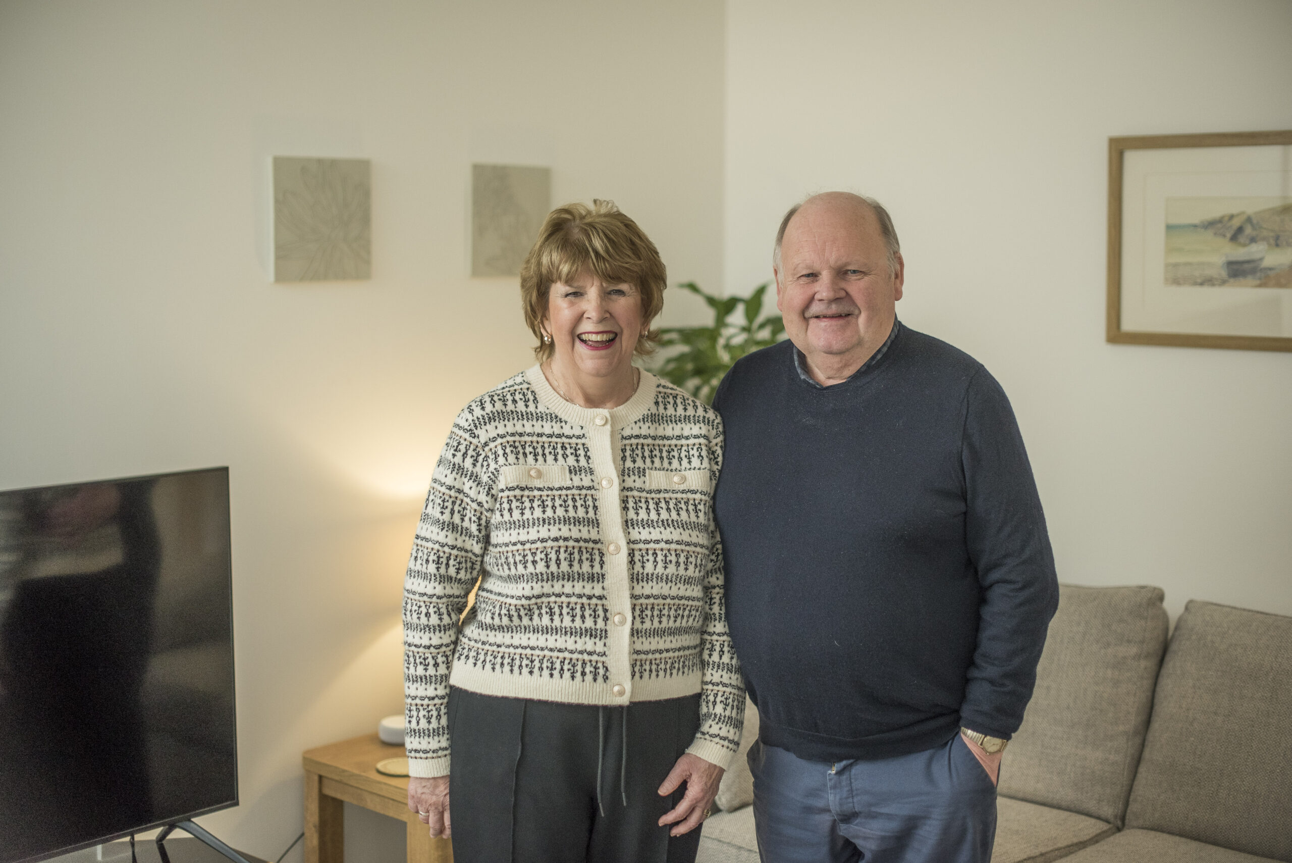 Steven and Ann standing in their living room