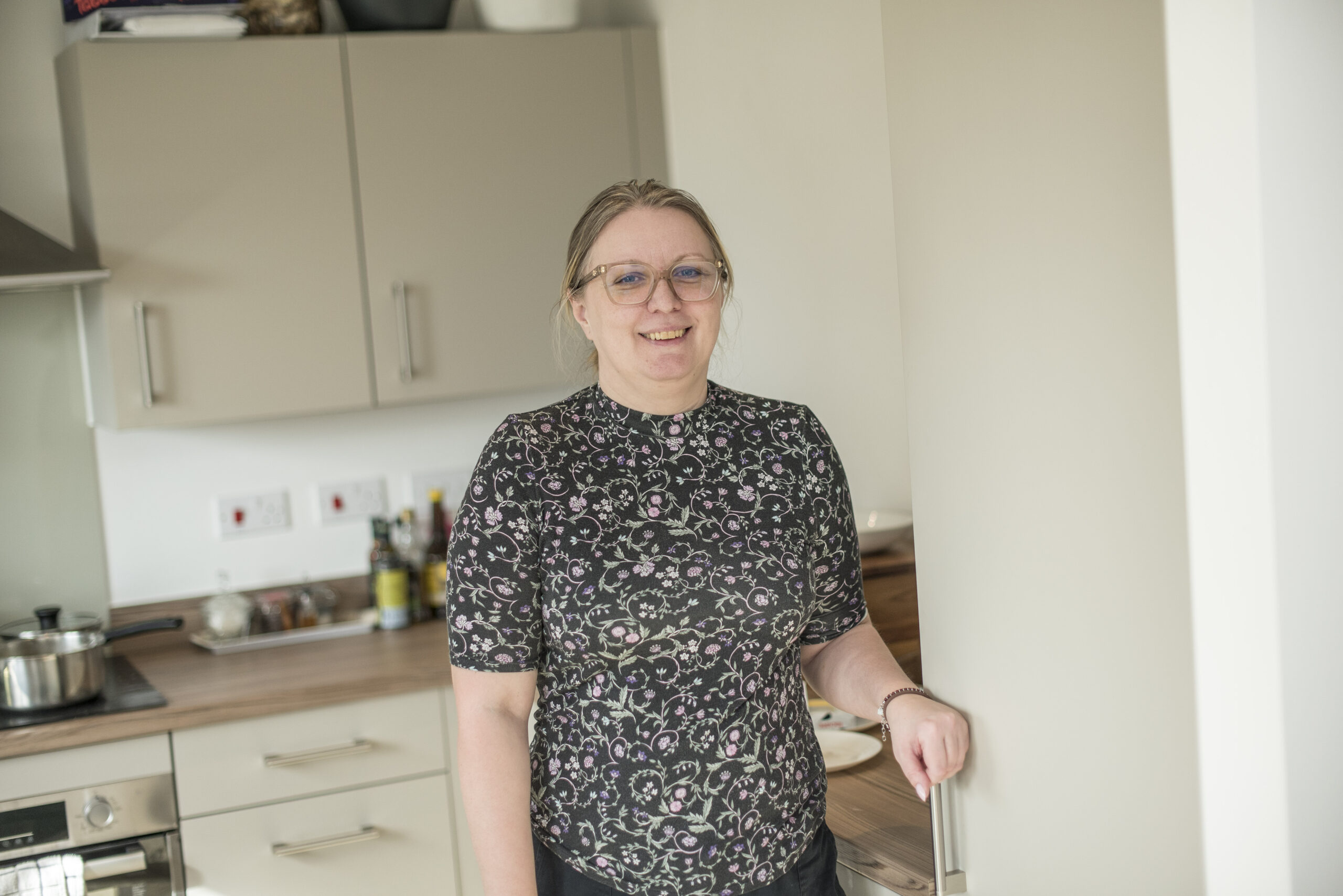 Katarzyna at the hob in her kitchen