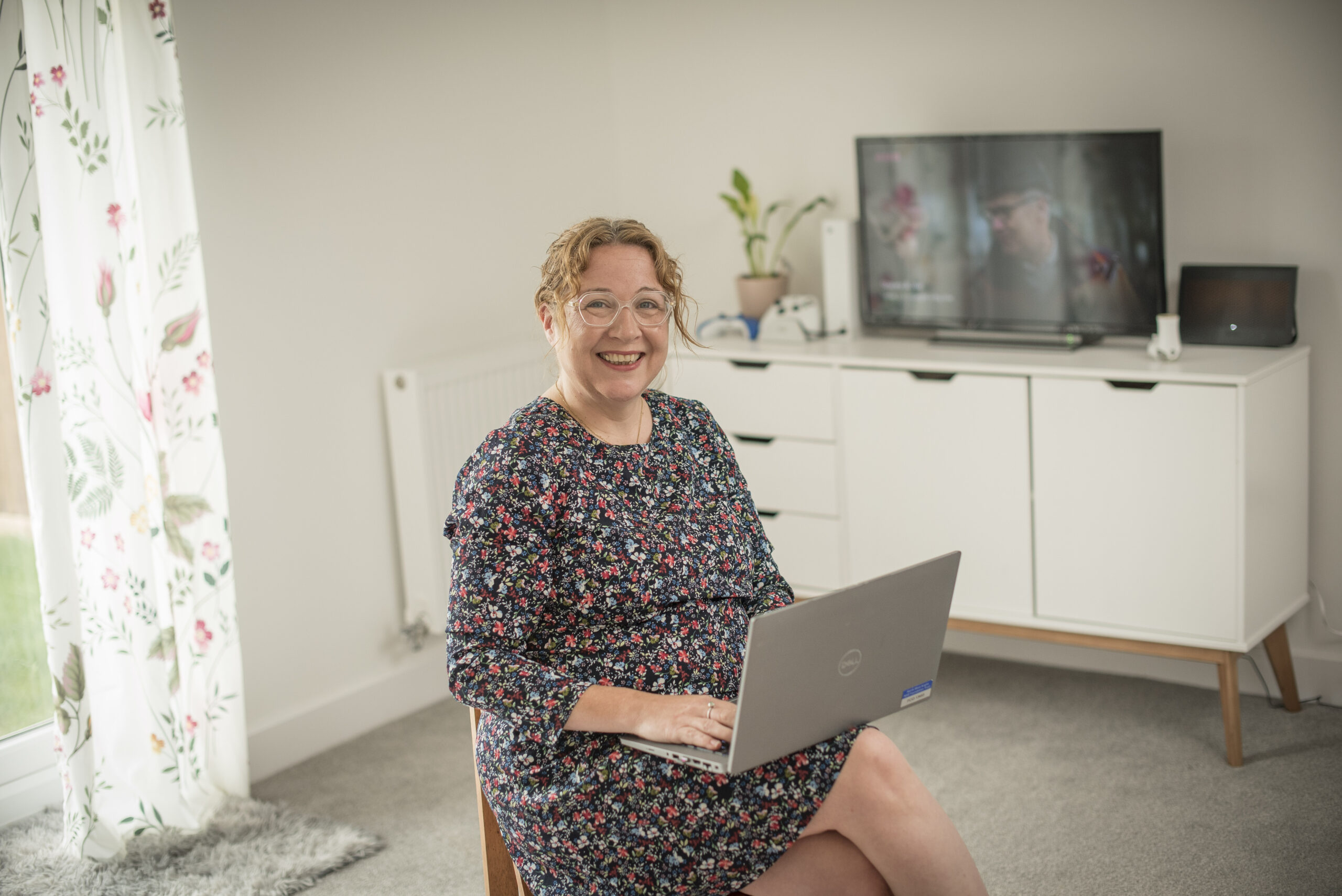 Katie sitting with a laptop